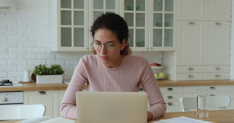 Confused young caucasian woman reading email on computer, taking off eyewear, feeling depressed of getting bad news online, professional exam failure, receiving dismissal notice, lost job concept. | Shutterstock HD Video #1066149799