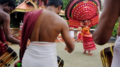 Payyanur, India - December 3, 2019: Theyyam perform during temple festival in Payyanur, Kerala, India. Theyyam is a popular ritual form of worship in Kerala, India. Slow motion