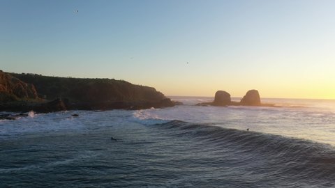 Surf, Epic Sunset, Punta de Lobos, pichilemu, chile.
man Surfing sport, beautiful, landscape, waves on the left. aerial shot with drone