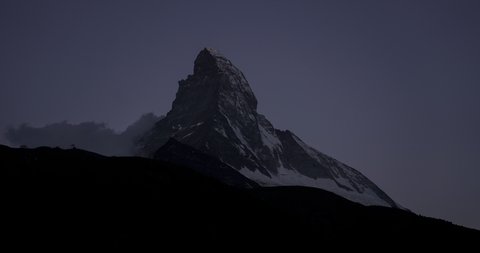 Timelapse of the Matterhorn mountain from Zermatt Village during sunrise - ORIGINAL 4K - STATIC