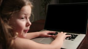 Children distance education lesson, technology for kids. Child girl doing school homework, using laptop computer at home. Video call by webcam on internet. Chroma key. Alpha channel - Powered by Shutterstock - Get 15% off with code: PIKWIZARD15