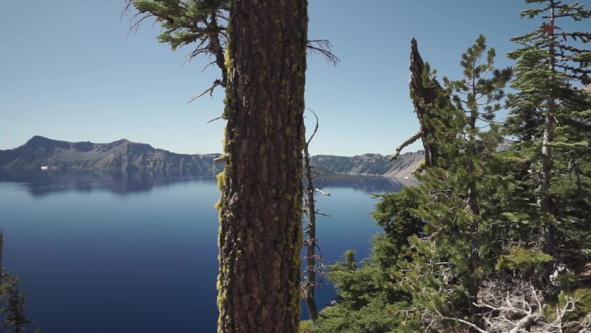 Crater Lake National Park in summer a beautiful sunny day with wonderful blue water. Lateral panorama shot from upside Rim Drive