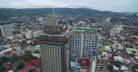 CEBU, PHILIPPINES - JANUARY 20, 2017: People on the Roof of Skyscraper. Cebu City Cityscape with Skyscrapers and Local Architecture. Philippines. Province of Philippines located in the Central Visayas