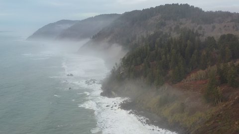 Mist drifts over the beautiful Northern California coastline in Klamath. The scenic Pacific Coast Highway runs along this amazing part of the west coast which is known for its extensive forests.