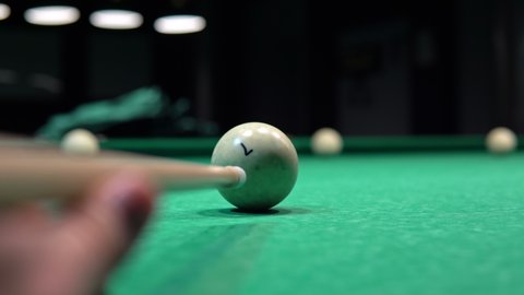 Close up of a billiard ball trying to pocket a billiard ball. Russian billiards game