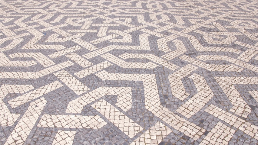 Typical portuguese cobblestone pavement in Lisbon Portugal 4k