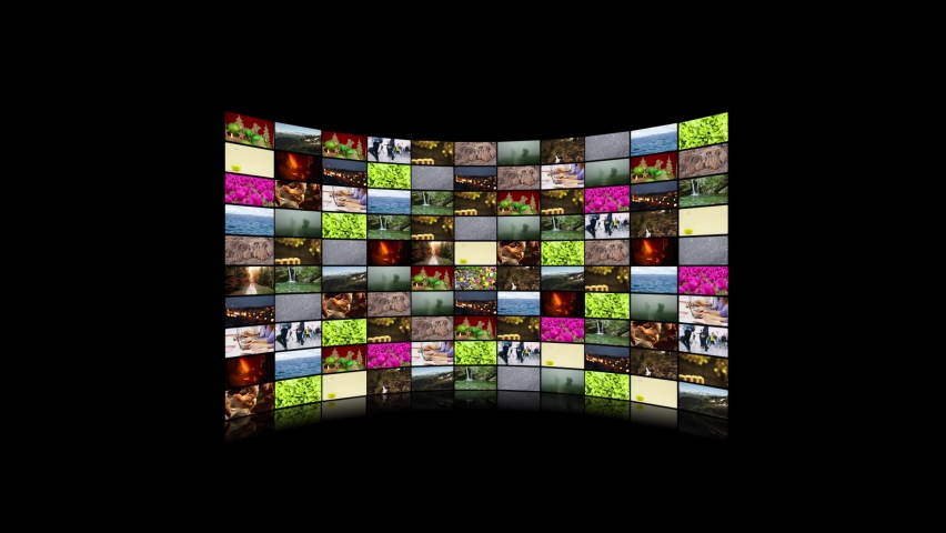 Zoom in on huge curved video screen wall with many movies playing (Full HD)