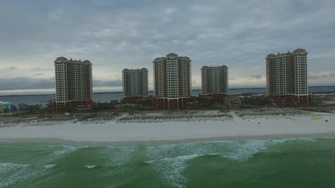 PENSACOLA, FLORIDA - APRIL 20, 2016: Empty Pensacola Beach in Florida. Portofino Towers in Background. Gulf of Mexico