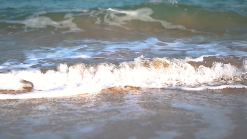 Slow motion shot of sea waves on the Shivrajpur Blue flag beach in Gujarat, India	