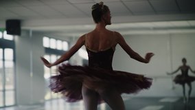 Low angle tracking shot of ballerina practicing spinning in dance studio , Lehi, Utah, United States