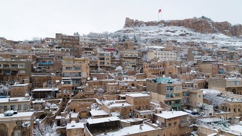 Aerial view of Old Mardin City landscape in Turkey. Snow weather