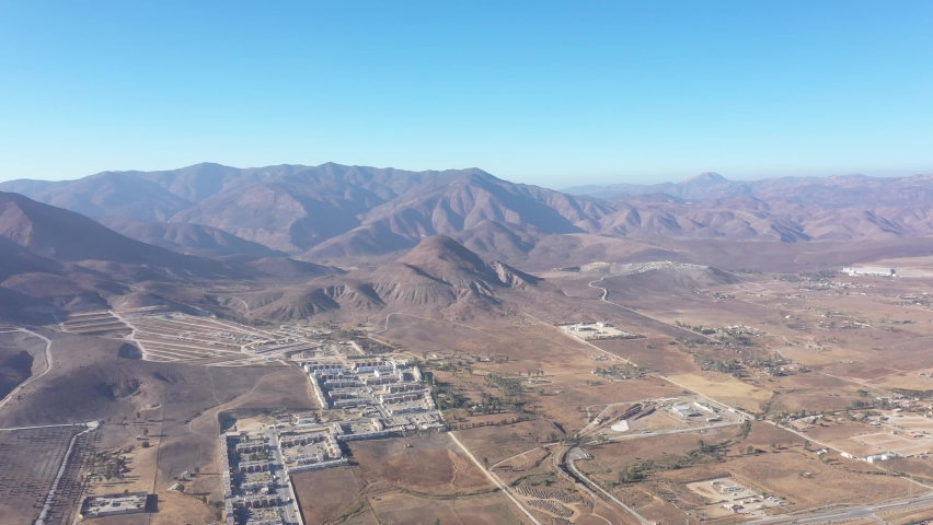 Little town from Tijuana, east side tijuana city, Baja California, near the mountains and blue skies, dron footage 4k from a wide view from a little town tijuana
