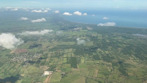 Veracruz Puerto city seen from an aircraf, landscape flight above the clouds
