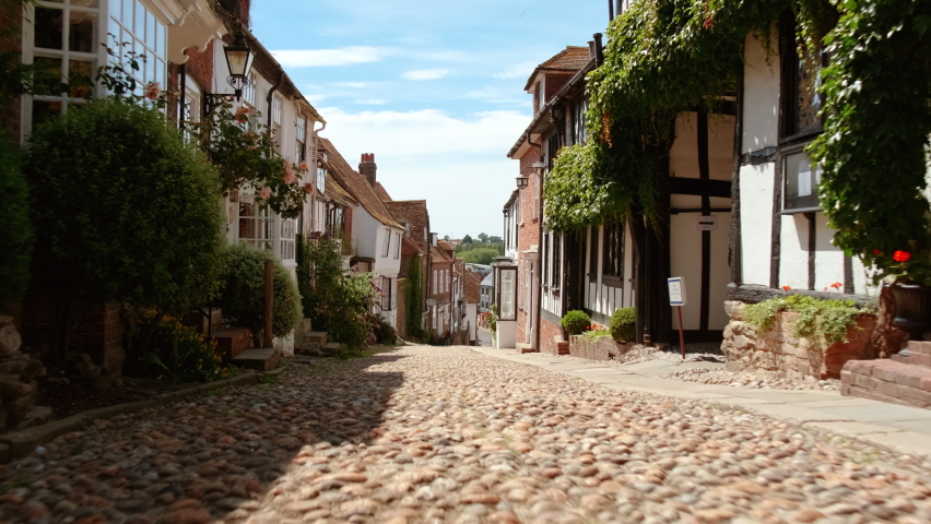 RYE, circa 2020 - Slow motion POV walk along the picturesque Mermaid Street in Rye, East Sussex, UK with impressive Tudor houses and cobblestone
