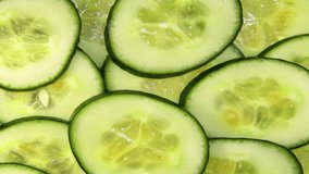 Animated cucumber on the background of sliced cucumbers.