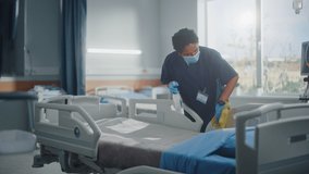 Hospital Ward: Professional Black Nurse Wearing Face Mask, Wiping the Bed, Cleaning Room After Covid-19 Patients Recover. Disinfection, Sterilizing, Sanitizing Clinic after Coronavirus Infected People - Powered by Shutterstock - Get 15% off with code: PIKWIZARD15