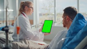 Hospital Ward: Friendly Female Doctor Talks to Sick Male Patient Resting in Bed, Shows Green Chroma Key Screen Tablet Computer, Explains Brain Results. Physician Talks to Man Recovering after Surgery - Powered by Shutterstock - Get 15% off with code: PIKWIZARD15