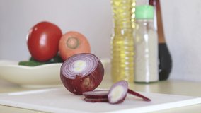 Cooking in the kitchen, Use a knife to cut onions.
