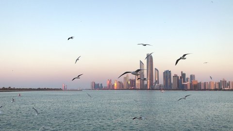 City Skyline and cityscape at sunset in Abu Dhabi UAE.