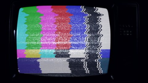 Old Television Set turning on Green Screen with Color Bars and Noise. Close Up. Dark Tone. 4k Resolution.
