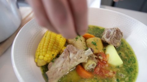 
Three-phase sancocho served on a plate, freshly made, traditional Colombian food