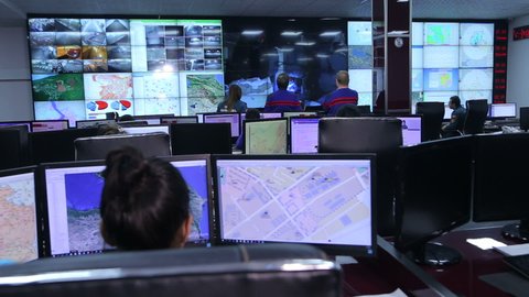 Yerevan, Armenia - December 2016 - Emergency workers work in a call center. Looks at the city map and the situation on the roads.