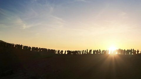 The Jews being expelled and going into exile all over the world in the Middle Ages., silhouette of Israelis walking in the sunset