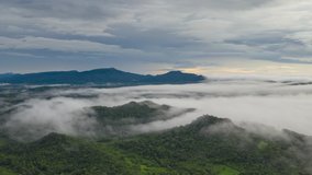 Hyper lapse video 4k, Aerial view Beautiful of morning scenery Golden light sunrise And the fog flows on high mountains.	