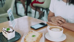 Restaurants place barcode labels for customers to scan for paying for food. Customers are scanning the QR code to order food. The concept of reducing exposure to prevent disease infection.
 - Powered by Shutterstock - Get 15% off with code: PIKWIZARD15