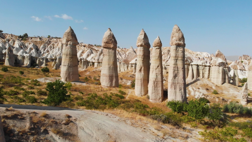 Cappadocia aerial drone view to Love Valley volcanic rock formations and fairy chimneys, Goreme, Turkey.