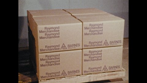 1970s: Stack of boxes marked with Raymond Merchandise Barnes label. Two springs side by side are put under pressure.