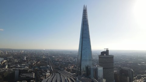 Aerial View Shot of London City Skyline Shard and Tower Bridge in foreground, Canary Wharf in background United Kingdom taken in January of 2021