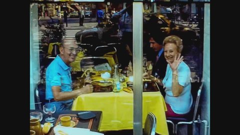PARIS, FRANCE JULY 1976: People at restaurant in Paris in 70's