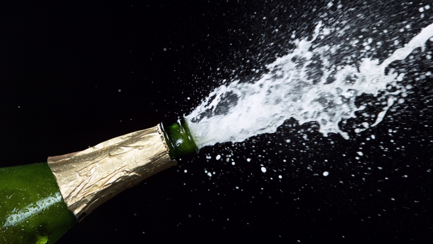 Super slow motion of Champagne explosion, opening champagne bottle closeup. Filmed on high speed cinema camera, 1000fps Royalty-Free Stock Footage #1066329781