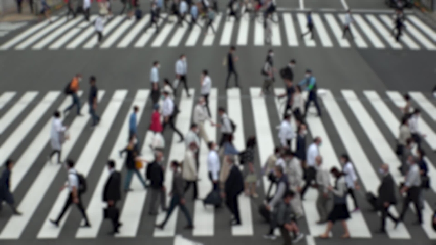 TOKYO, JAPAN : Aerial high angle view of crowd of people walking at zebra crossing in rush hour. Commuters at the street. Japanese city lifestyle, business and work concept. Slow motion blurred shot. | Shutterstock HD Video #1066334332