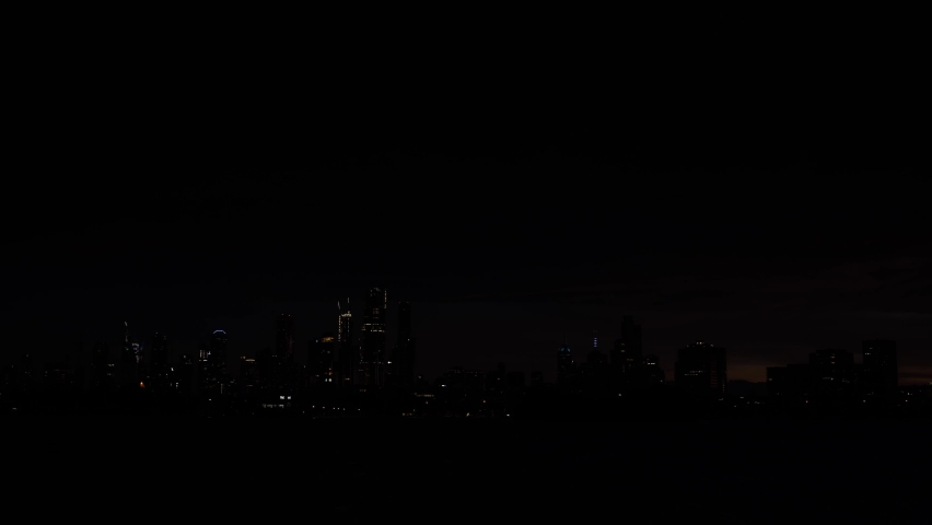 Time-lapse of Melbourne city skyline during sunrise.