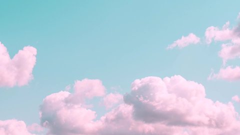 Motions clouds. Puffy fluffy beautiful pink clouds on turquise sky time lapse. Slow moving clouds. Pastel palette. Minimalism