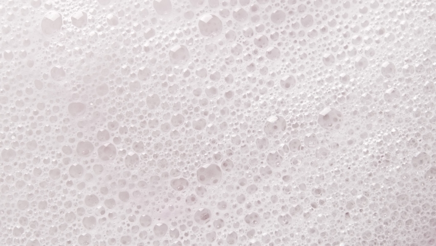 Texture of white soap foam with bubbles abstract background. Royalty-Free Stock Footage #1066354882