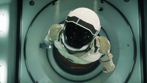 Somewhere in distant space, an astronaut hovers inside his spaceship. The animation is for fantastic, the futuristic or space travel backgrounds.