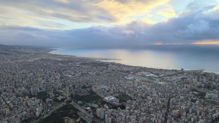 Drone Shot - Fly over Beirut showing Beirut Airport, southern suburbs, and Beirut Sports City Royalty-Free Stock Footage #1066370644