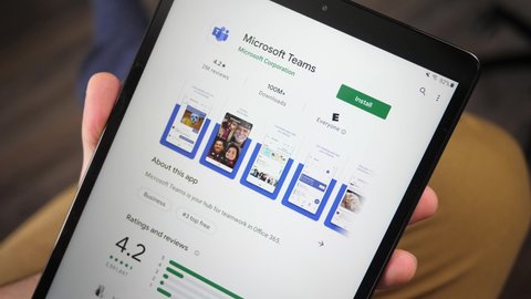 Downloading Microsoft teams app on a tablet screen.This app is mainly used to connect people during the pandemic helping them communicate with each other. MONTREAL CANADA JANUARY 2021