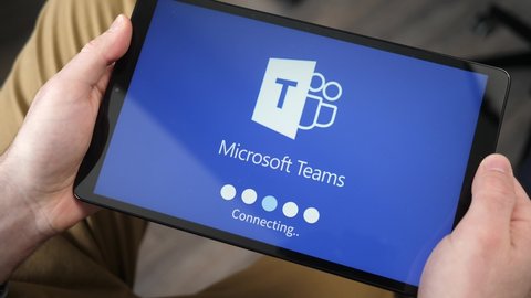 Loading Microsoft teams app on the tablet screen. This app is used to video conference during the pandemic helping connecting people. MONTREAL CANADA JANUARY 2021