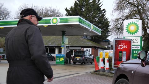 READING, UK - JANUARY 28, 2021: People at a BP petrol station in Reading, Berkshire, UK.