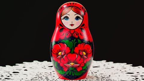 Beautiful handmade matryoshka dolls. Animation showing inside of Babushka. Set of cute traditional wooden Russian toys of decreasing size. Art souvenir painted with colourful ornaments. Handcrafts.