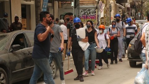 Beirut, Lebanon -  August 5th, 2020: Volunteers help and clean roads because of the explosion port of Beirut in the 4th of august