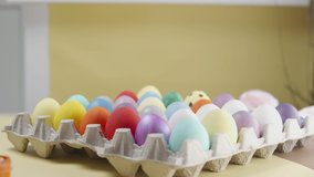 Multicolored Easter eggs on a yellow background. Preparing for Easter. Paint the easter egg