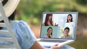 Back view of businesswoman talk with business partners using video call on laptop discuss project online. Work from Home, Online meeting concept.