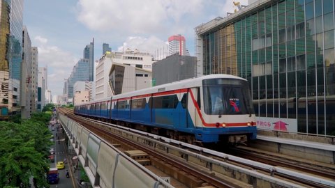 BANGKOK, THAILAND 24 Sep 2020 : BTS Sky Train on rail tracks with traffic located on Silom Road