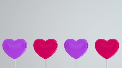 Purple pink hearts on white sticks on white isolated background. Move to the left and rotate. Copy space. Symbols of love, like, Happy Women's, Mother's, Valentine's, birthday. 3d animation loop of 4K