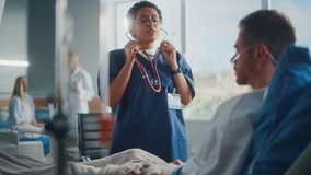 Hospital Ward: Friendly Black Head Nurse Uses Stethoscope to Listen to Heartbeat and Lungs of Recovering Male Patient Resting in Bed, Does Checkup. Man Getting well after Successful Surgery - Powered by Shutterstock - Get 15% off with code: PIKWIZARD15